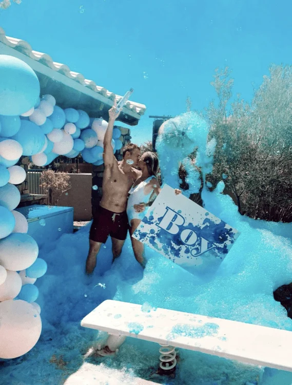 Colored foam party for a gender reveal